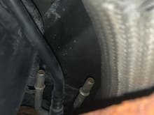 Emissions Vapor? lines above spare tire cross member. I found them disconnected!