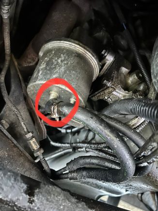 Fuel leak at line connection circled.