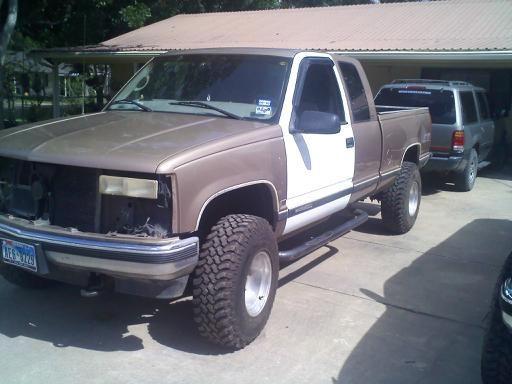 Big Sexy in progress. new tires on.rims sanded with 80 grit. next 220. then 400. ( they looked horrible before ) old headlights held water. i have them changed out already