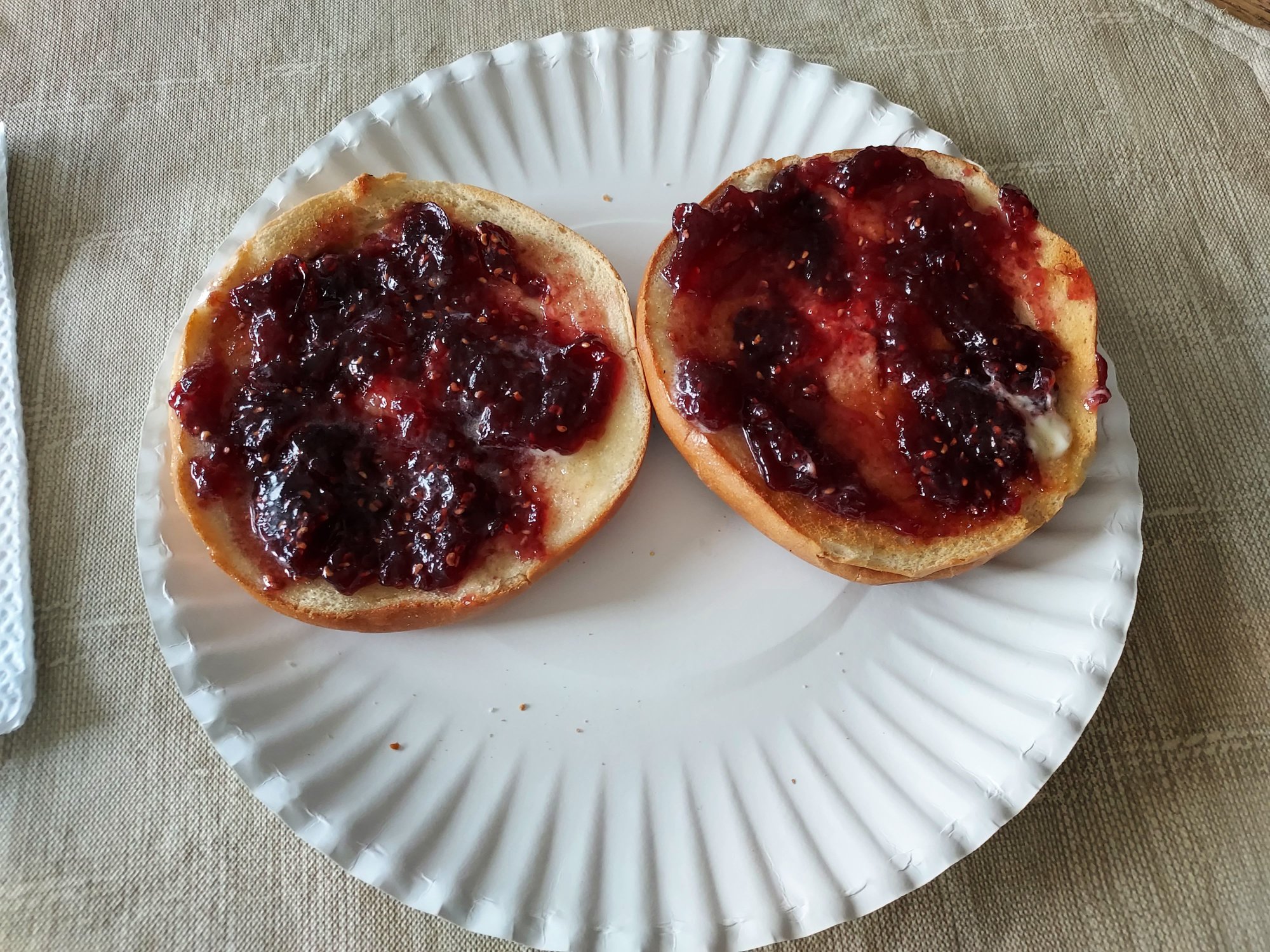 Plain Bagel with plenty of Butter and Raspberry Jam for dessert!