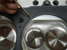 4.200" ID MLS head gasket for 4.125" bore Screwdriver indicating the fire ring / combustion chamber seal