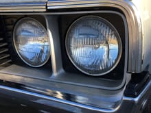 I guess all 4 headlights are original.  Car also has original shocks and other relics