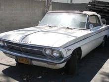 White 1962 F-85 Deluxe Series Cutlass Convertible. Just sold it on 7/8/2012. Auto trans, not running. White convertible top, red &amp; white interior. Appears complete.
My first car! Dad taught me how to work on my own car, starting with this one. He bought it in the early '80's, then I eventually gave it back to him, when I needed an everyday commuter car. My dad passed away in 2009 and I inherited all of his cars, including this one.