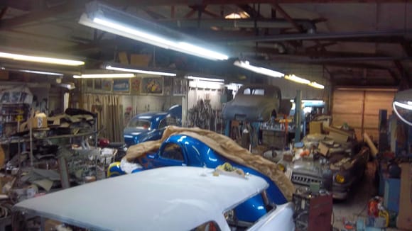 Just a cool shot of my dirty, crowded shop, and mu other projects! Just so you know I'm not slacking on  the Olds! 50 Chevy behind the curtains, Barris sectioned 40 on the lift, awaiting it's chassis, Willys in the middle, and my friend Kenny's chopped 54 Plymouth (he's building a new chassis with Vette suspension for it, on the frame table, to the far left)