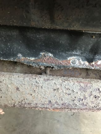 Found this under the rear bumper. Lots of rust where the fuel tank straps hang from the rear of the trunk.
