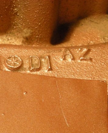 Rust-oleum sample on bottom; original Olds paint on manifold on upper