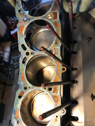 Holy Indian Head copper gasket shellac Batman!

This crud was everywhere on the edges of the bores and it was hardened into big chunks on top of the pistons....   even more reason to tear this thing down.   Typical Fel Pro 8171PT Head gaskets (.040 compressed)  nice 3/8 pushrods though!