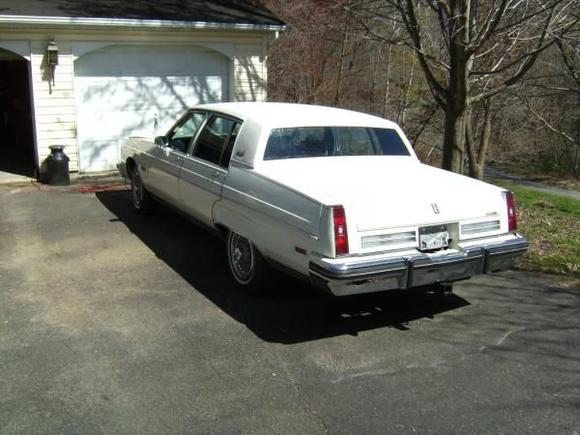 Rear bumper and filler panel have since been replaced.  Repainted tail extensions and rear panel, replaced chrome trim and taillights as originals were crazed and faded.  Still not quite happy with color match of extensions (original paint faded vs custom ordered factory paint)and may redo them.