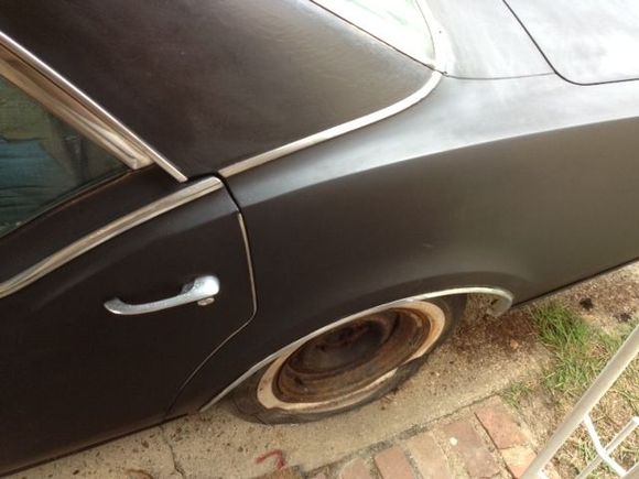 This is a few days worth of sanding, cleaning, and painting on the rear end of the car.  I am using rustoleum flat black enamel rattle can paint.  I surprised myself with this decision, and the finish is actually quite nice.