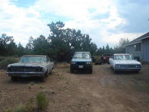 The back-yard of our house, (Right Dynamic 88) (Back Right 1962 F 85) (Middle Japanese crap) (Left 63' Starfire)