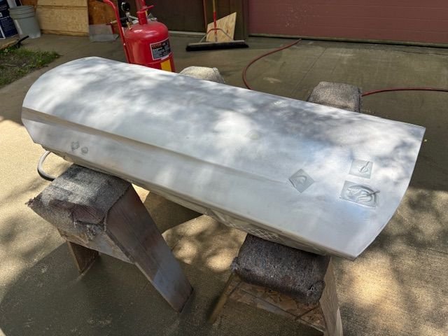 Door face after blasting.  90 degrees in Iowa, with high humidity..  I plan to epoxy prime, just one coat, to seal it up.  I think I may have to weld buildup the latch end to make panel joint between the new Quarter panel.  So looking for a break in heat and humidity so I can paint it.  
