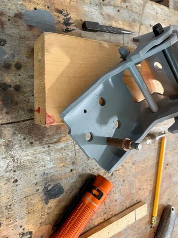 The car side hinge leaf, with two holes.  Cleco inserted to test