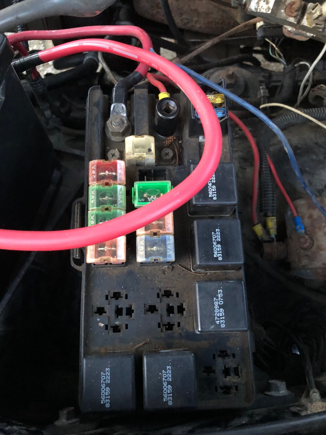 the red wire with the socket on it goes to the contraption of stuff when im pretty sure that is where the alternator wire is meant to go and the positive on the alternator has nothing so im not sure