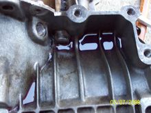Leak was oozing to the top of the transmission. The transmission oil was coming out of the bell housing too.