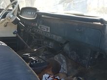 Has an almost unmolested dash, with the factory radio and A/C evap