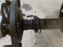 Finally got it loose nice groove in axle  and bearings fell out so I guess bearings failed.   Kinda blows since a shop just did this side.   I looked on rockauto for a new axle but confused the ones they show have slightly different lengths.  Will that matter.  