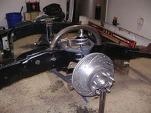 Shock mount hoop. The shock is fully extended here, so the bolt hole will be about 2-1/2" lower. 