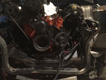 318 sitting high with oil pan touching cross member. Engine is back all the way