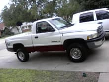 my truck the day i got it i hate that maroon strip i wanna paint it  but i dnt know what color ..lol and i hate the 4x4 off road decals they have since been removed