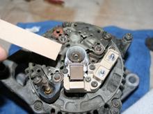 to install my alternators type of brush assembly, all I did was cut a strip of thin cardboard from a notepad and used it to hold the spring loaded brushes down into the case as I slipped the assembly over the rotor shaft and seated it into position..often the assembly 'spring case' has a small hole for this procedure..where you can use a toothpick or red tube that often comes with a can of wd-40, to hold the bruches in place...