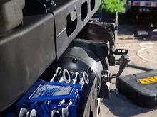 This 12k pound Badland winch will fit just fine, I can either space the front bumper out 3/4" or I can Notch the lower radiator support on one side or the other to clear the motor (See second pic for detail)