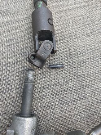 Use a 7/32 allen key as a punch and drive out that pin (if you haven't already done so when pulling the rack)