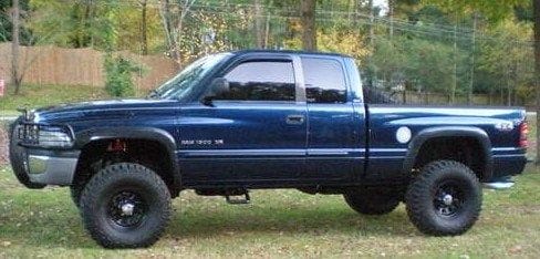 Next Dodge....was my Son's truck....He pass the summer before last due to cancer....so I sold my and finished his the way he wanted it......Here it is with three inch lift...new shocks....duel stablelizers.....35 Mickey Thompson.....