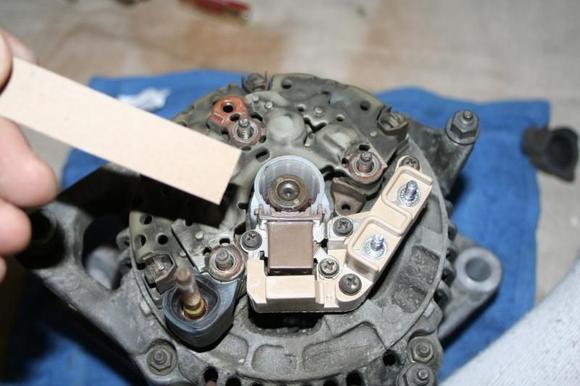 to install my alternators type of brush assembly, all I did was cut a strip of thin cardboard from a notepad and used it to hold the spring loaded brushes down into the case as I slipped the assembly over the rotor shaft and seated it into position..often the assembly 'spring case' has a small hole for this procedure..where you can use a toothpick or red tube that often comes with a can of wd-40, to hold the bruches in place...