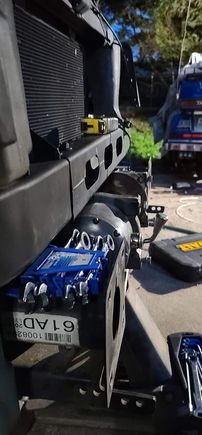 This 12k pound Badland winch will fit just fine, I can either space the front bumper out 3/4" or I can Notch the lower radiator support on one side or the other to clear the motor (See second pic for detail)