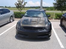 Carbon Fiber hood, billet grille painted gloss black, smoked out head lights, clear side markers