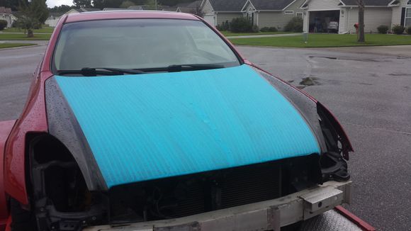 Center of the hood under the masking will remain cf.  Outer sides will be Laser Red.