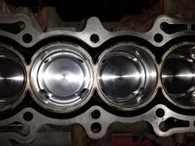 An overhead of all four cylinders with the pistons at half mast.