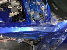 I make the brake light wires go out of the same hole where the wiper motor wires used to go into. Used the factory grommet. 