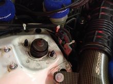 So the little bracket mounted to the side of the strut tower was in the way I have to take it off and cut the useless piece off from it.