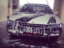 At the car wash giving her a bath