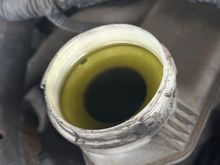 2007 accord is this brake fluid contaminated or is the reservoir just dirty? Thoughts?