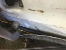 Along the floorboard where the trim can cover it