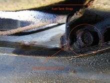 Technically, all I should have to do is loosen this bolt and slide the fuel tank strap off the bracket, but there's no clearance to get a socket on the bolt. If I saw through the strap, there's no clearance to remove the bracket, either. Is there a special tool that can help?