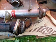 Factory hanger & flange look great... Bosal hangerand flange is covered with rust. Welds are tragic on the Bosal.
