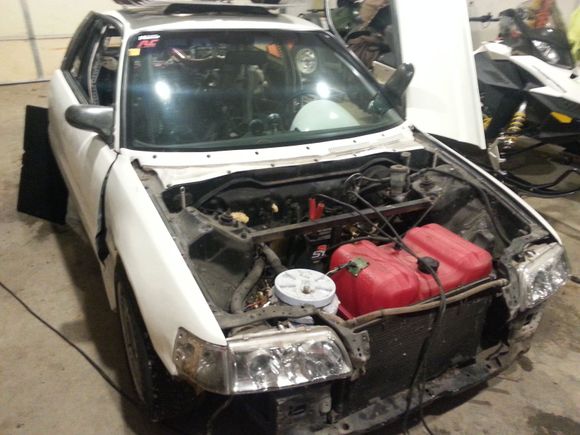 this is what the car looked like when we pulled it in the shop.  you can see some of the builers ingenuity with the boat tank in the front and the car is full of expanding foam