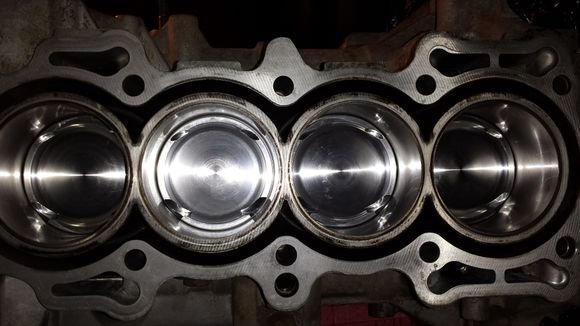 An overhead of all four cylinders with the pistons at half mast.