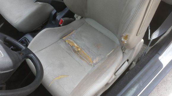 The ripped up drivers seat