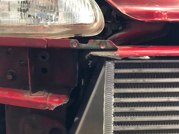 If you compare this side to the driver side you'll see how much of the bracket youll need to shave off. 