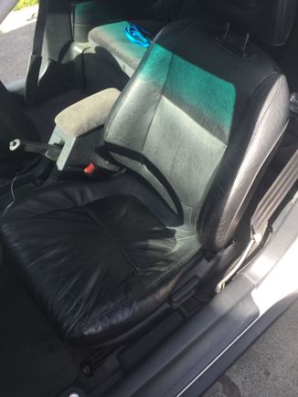 DC leather.. All four corners are mounted, and passenger rolls forward when you put the back forward, ya know?