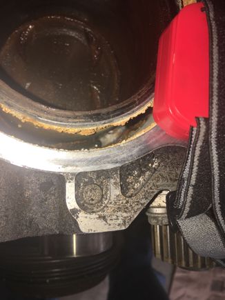 I did pour transmission fluid in the spark plug holes before pulling motor trying to unseize 1 and 3 cylinder is where it's froze and the cylinder walls where rusty i wiped off and tranny fluid it was sitting on top of pistons looked like the dude had just water in the no antifreeze .. it looks like some kind of foam never seen that before ?