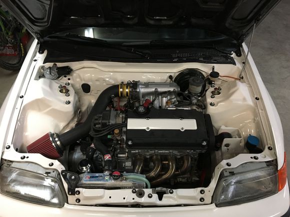 I got some downstar hardware for the fenders, t-bar and hood. Also cut the belt cover off the valve cover and got an intake on.(still need a new intake boot tho) also got a mishimoto coolant overflow. Also have a new set of carbon sunchros and a Mfactory lsd that will get installed soon. Also put ctr cams in and new valvestem seals and polished the valves.