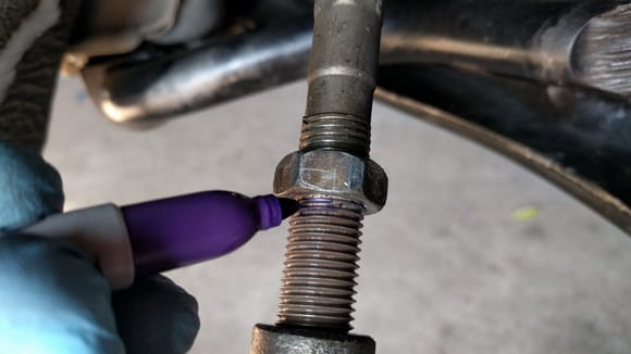 Finally it came loose.  I marked the threads to not screw up the alignment too much.  Remove the tie rod end and nut completely.