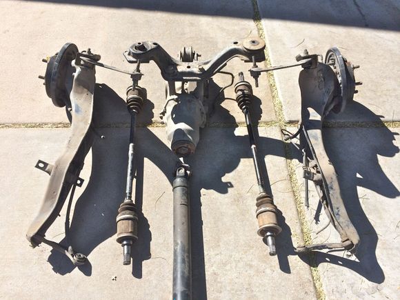 Rear diff, trailing arms, both axles (only using one of these), and drive line.