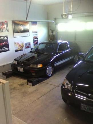 Back when I 1st got her. Ripped seats, leaking sunroof, Red pin stripes and the hideous silver CRX band across the bottom.