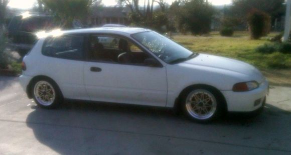 It has a dual cam motor swap, slipstreem bronze wheels, coilover suspention to lower, front lip, hid lights, full exhaust, fog lights, mudflaps